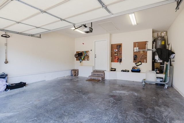 garage featuring electric water heater and a garage door opener