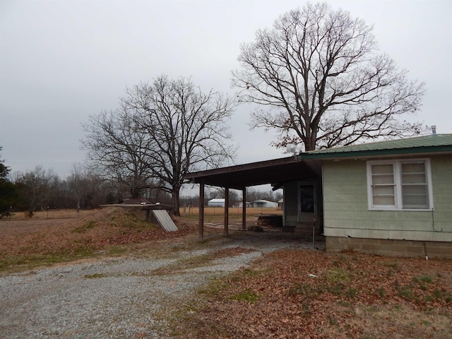 exterior space with a carport