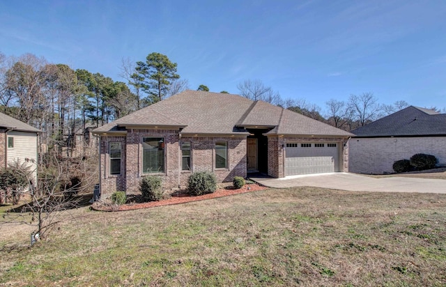 view of front of house featuring a front yard and a garage