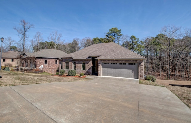 prairie-style home with a garage and a front yard