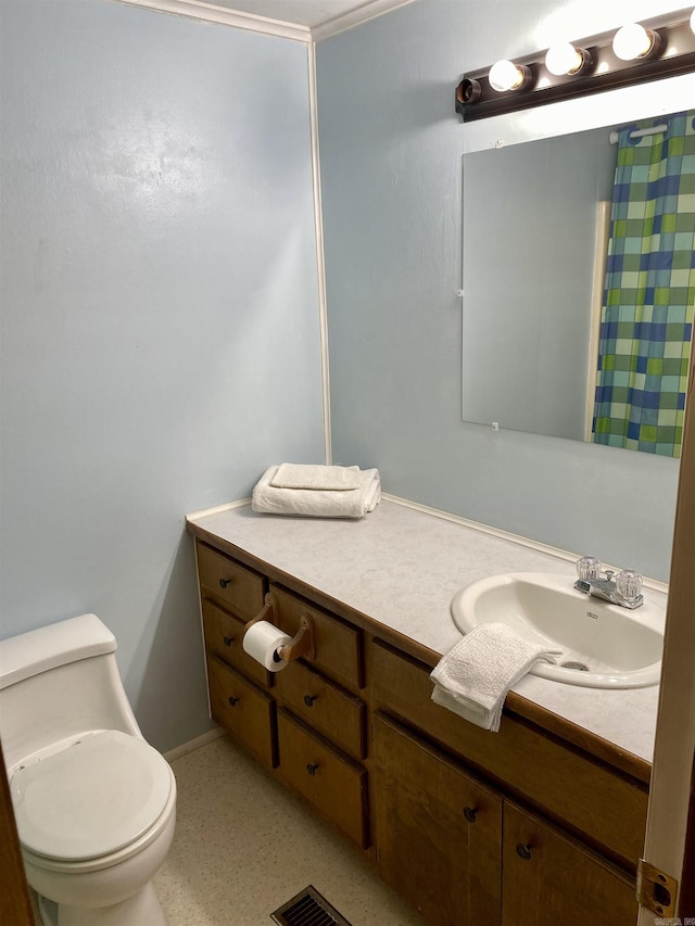 bathroom featuring vanity and toilet