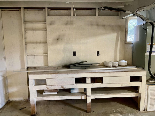 interior space with a workshop area and concrete floors