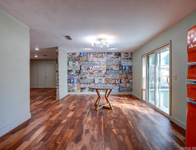 unfurnished room featuring hardwood / wood-style flooring