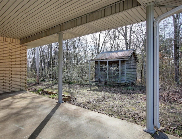 view of patio / terrace featuring a shed