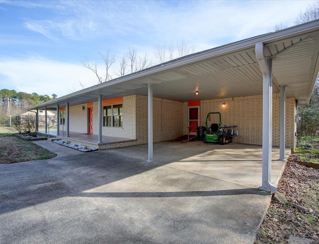 view of vehicle parking with a carport