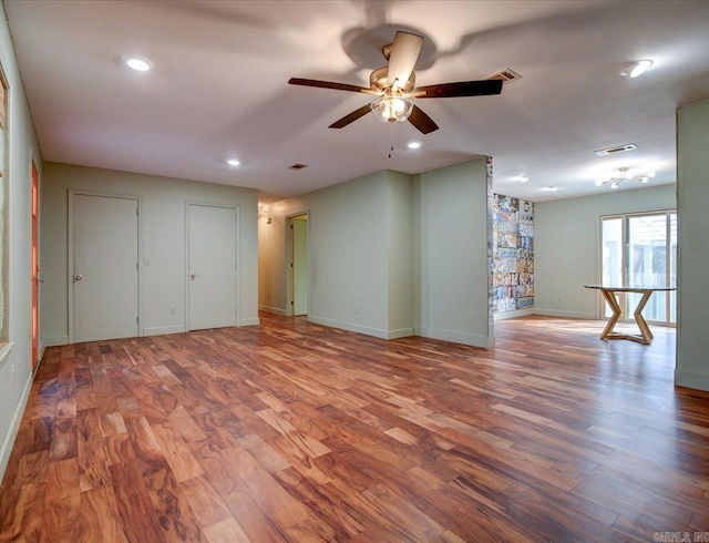 unfurnished room featuring ceiling fan and wood-type flooring