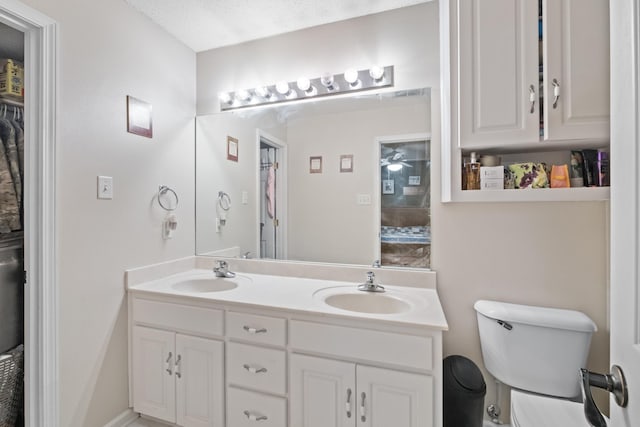 bathroom featuring toilet and vanity