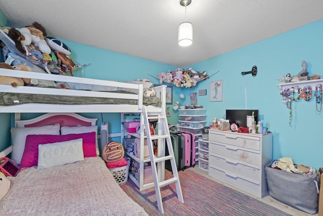 carpeted bedroom with a textured ceiling