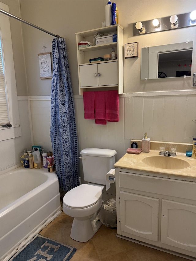 full bathroom featuring shower / tub combo with curtain, toilet, vanity, and tile patterned flooring