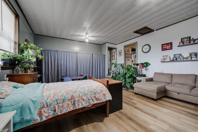 bedroom with light wood finished floors