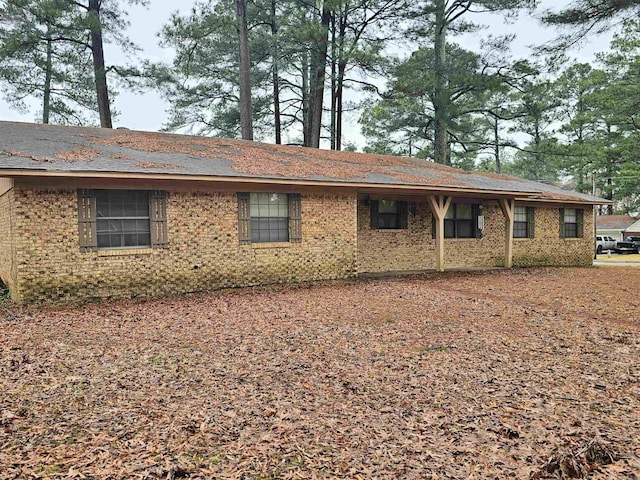 view of property exterior featuring brick siding