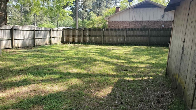 view of yard featuring a fenced backyard