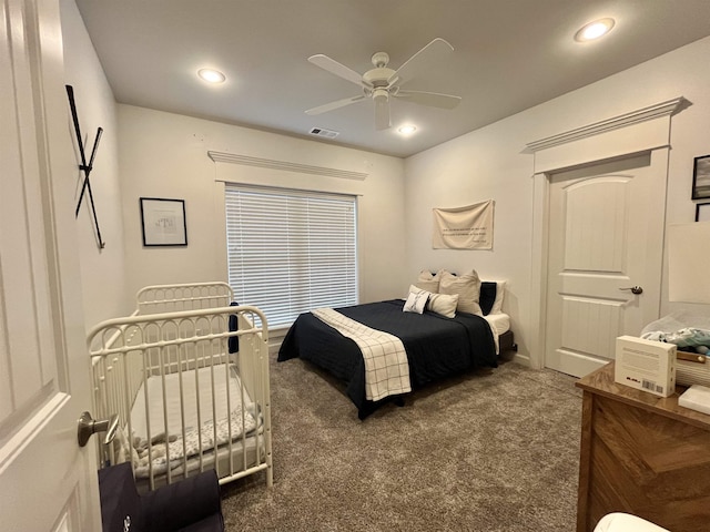 bedroom with visible vents, dark colored carpet, and recessed lighting