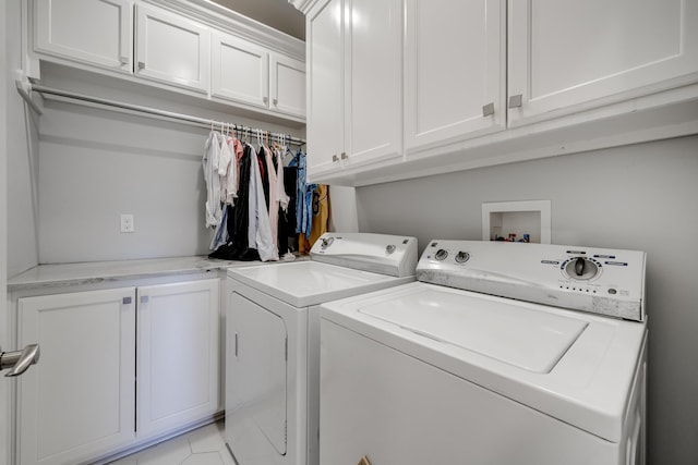 laundry room featuring cabinet space and washing machine and clothes dryer