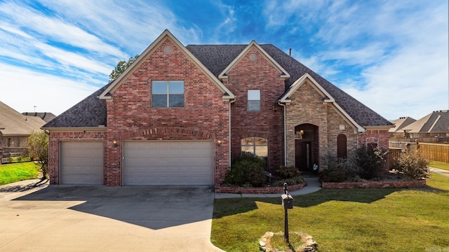 view of front facade featuring a front lawn and a garage