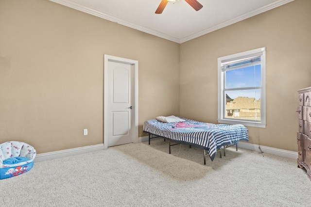 bedroom with carpet floors, ornamental molding, and ceiling fan