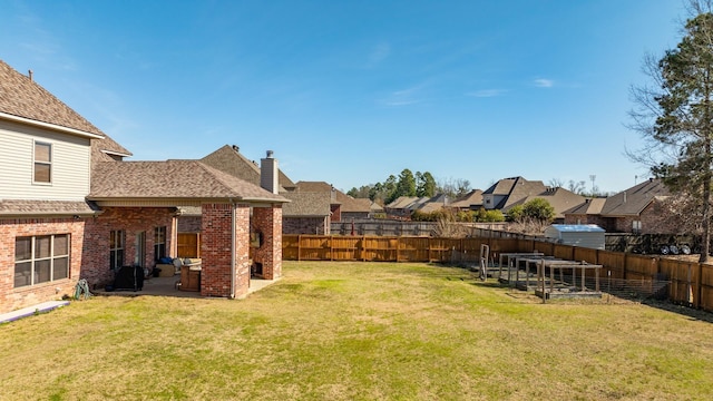 view of yard with a patio and a trampoline