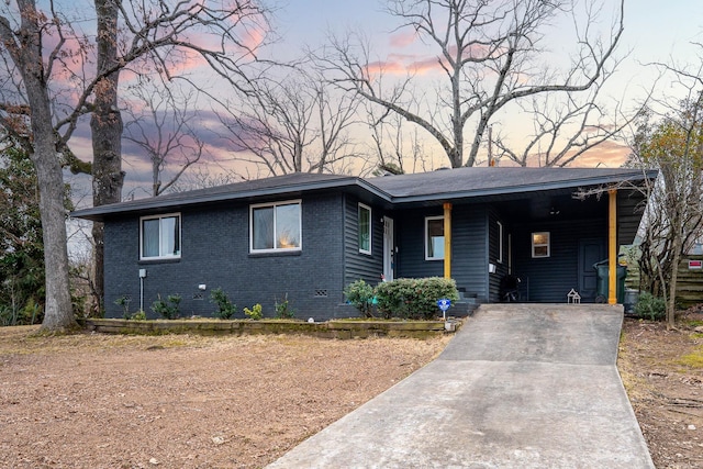 view of front of home featuring a carport