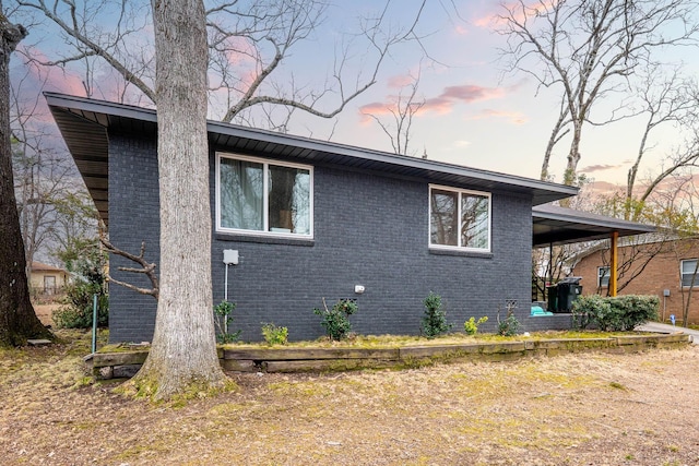 view of property exterior at dusk