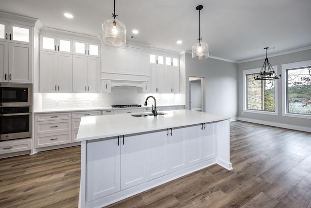 kitchen featuring sink, oven, and white cabinetry