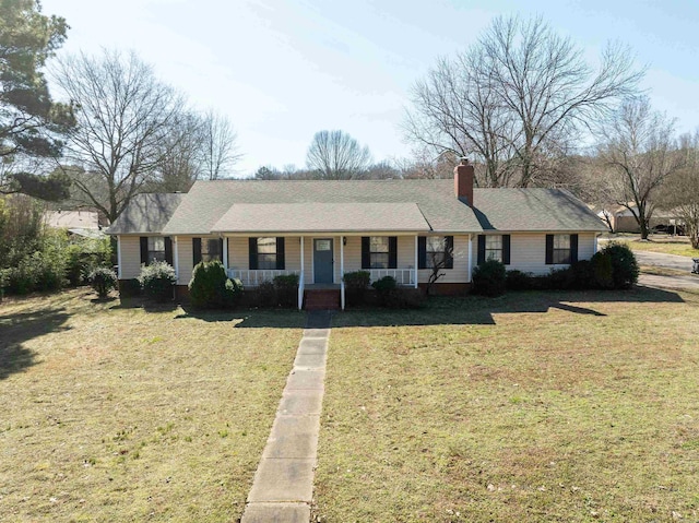 ranch-style house with a porch and a front yard