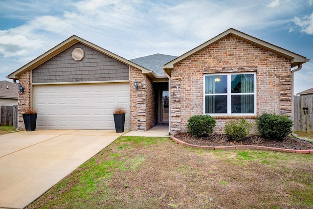 view of front of home featuring a front yard and a garage