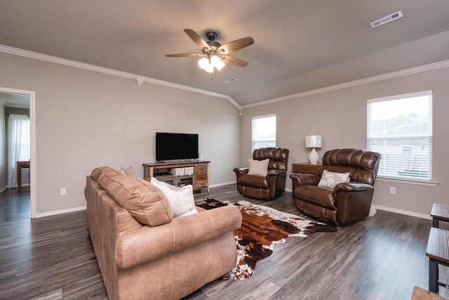 living room with ornamental molding, dark hardwood / wood-style floors, and plenty of natural light