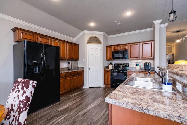 kitchen featuring sink, pendant lighting, crown molding, dark wood-type flooring, and black appliances