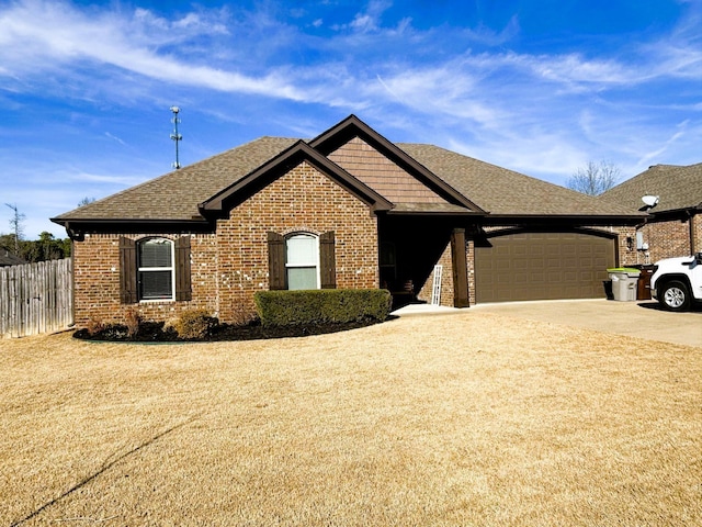 view of front facade with a garage and a front yard