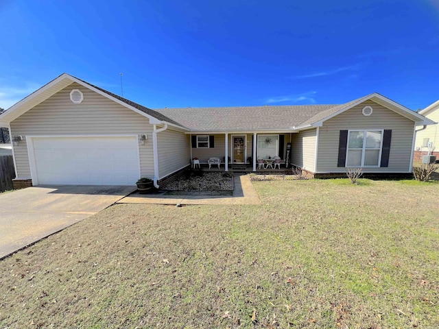 single story home with covered porch, a front lawn, and a garage