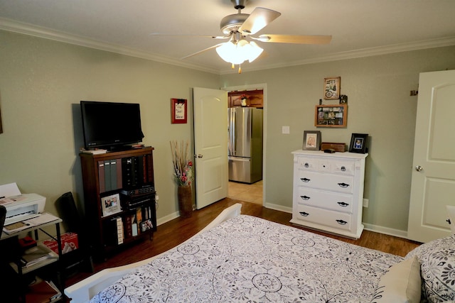 bedroom featuring wood-type flooring, crown molding, and stainless steel refrigerator