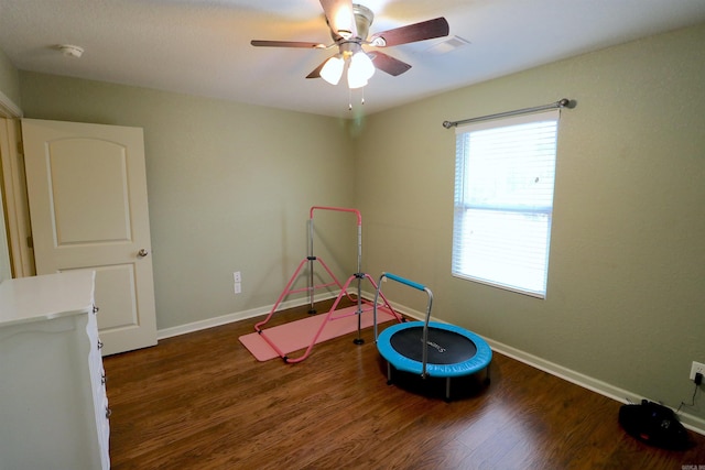 rec room featuring ceiling fan and dark hardwood / wood-style floors