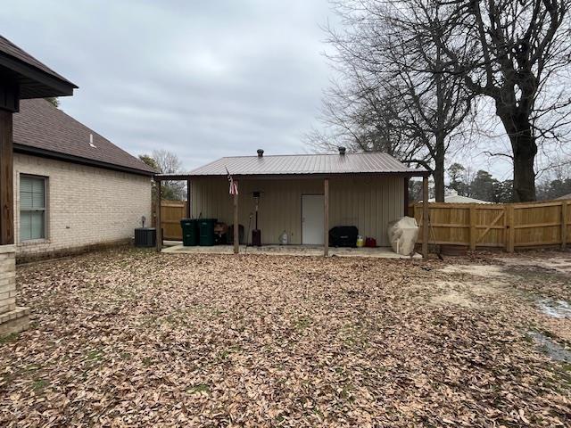 back of property featuring a patio and cooling unit