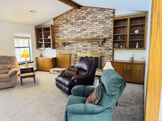 living room with a brick fireplace, vaulted ceiling with beams, and light colored carpet