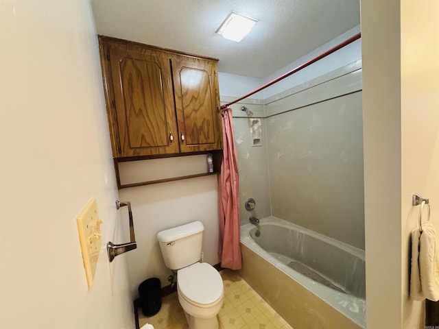 bathroom featuring toilet and shower / bathtub combination with curtain