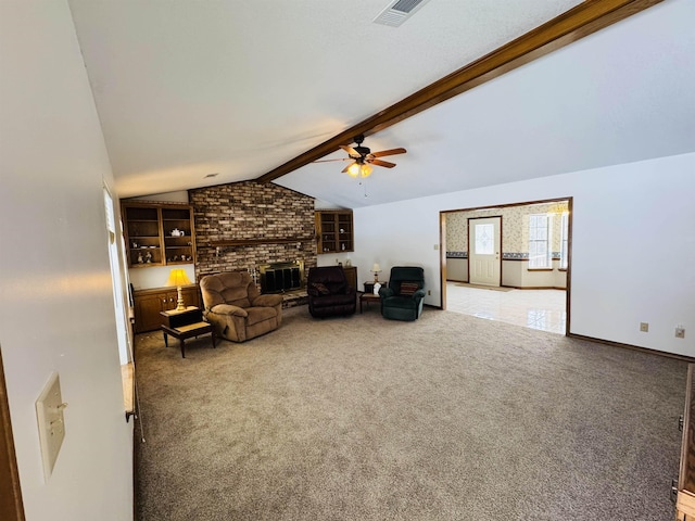 carpeted living room featuring a fireplace, vaulted ceiling with beams, and ceiling fan