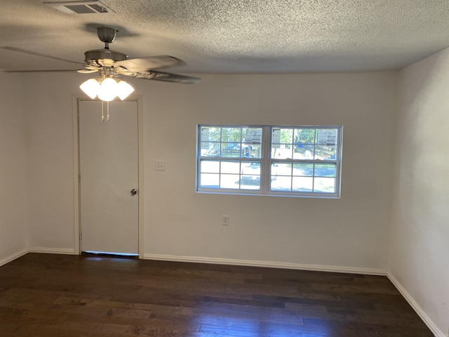 unfurnished room featuring a textured ceiling, ceiling fan, and dark hardwood / wood-style flooring