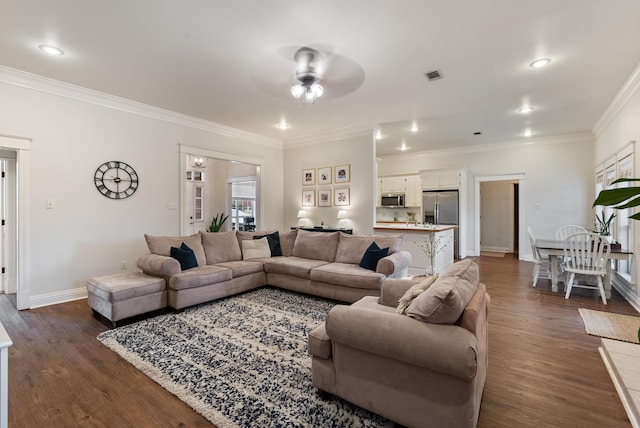 living room with ceiling fan, dark hardwood / wood-style floors, and ornamental molding