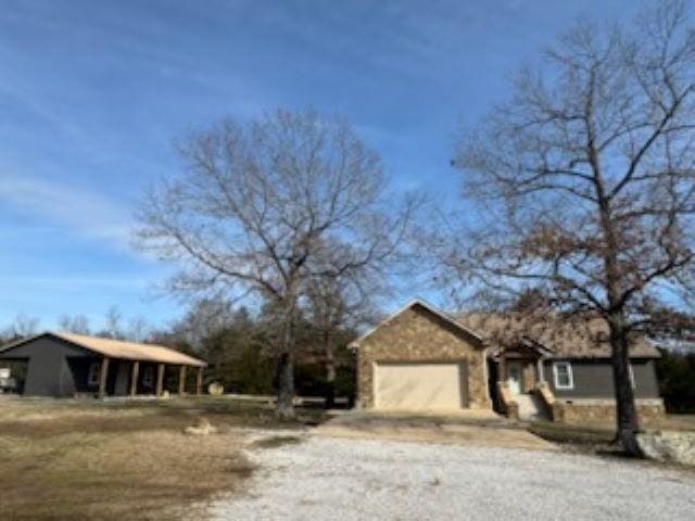 view of front of property with driveway and a garage