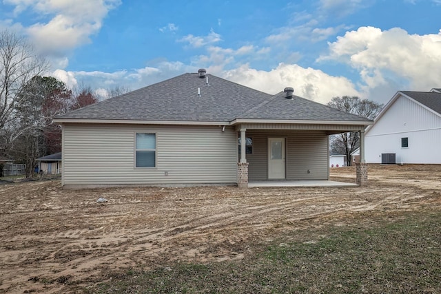 rear view of property with a patio and central AC unit