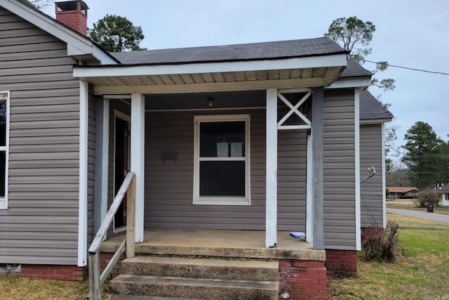 doorway to property featuring a porch