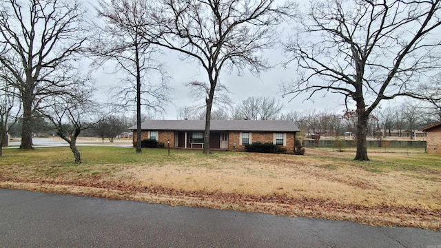 ranch-style house with a front lawn