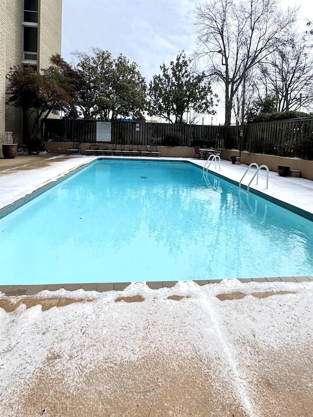 view of snow covered pool