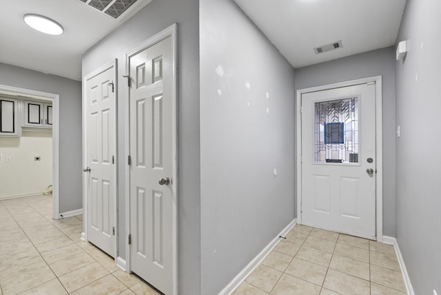 interior space with light tile patterned floors