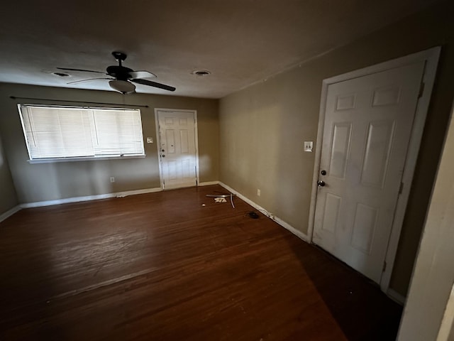 entrance foyer with dark hardwood / wood-style floors and ceiling fan