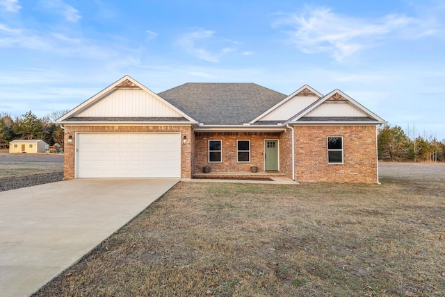 craftsman house with a front yard and a garage