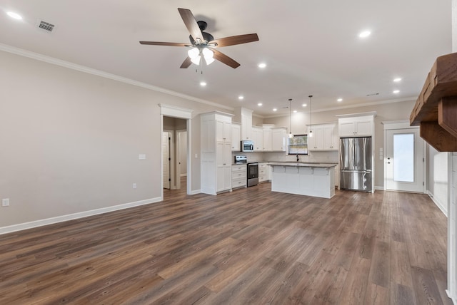 unfurnished living room with sink, crown molding, dark wood-type flooring, and ceiling fan