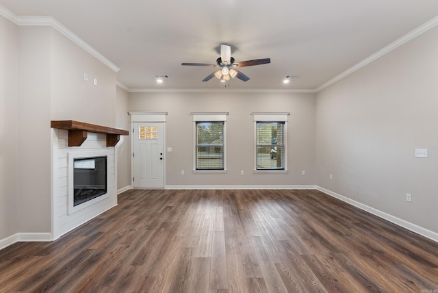 unfurnished living room featuring ceiling fan, dark wood-type flooring, and crown molding