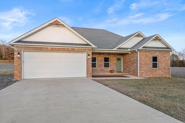 view of front of house with a front lawn and a garage