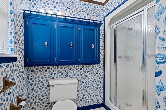 bathroom featuring an enclosed shower and toilet